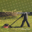 Mowing Grass While Dressed Up In A Suit cover
