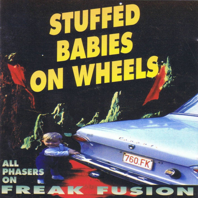 Stuffed Babies on Wheels Photo