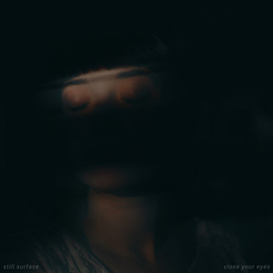 close your eyes by still surface