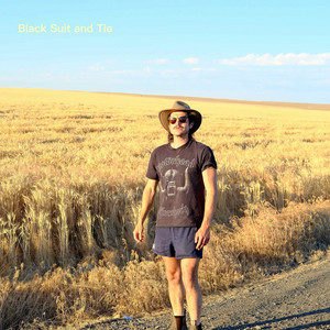 Black Suit and Tie by Tom Jenkins