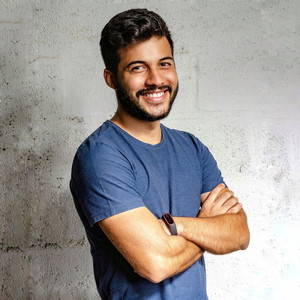 Man_Smiling_Alone_Without_Royalties.jpg by Oliver Buckland