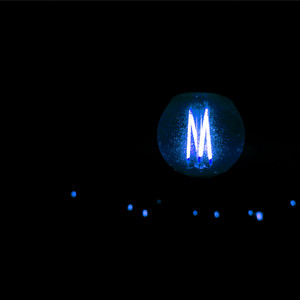 M.