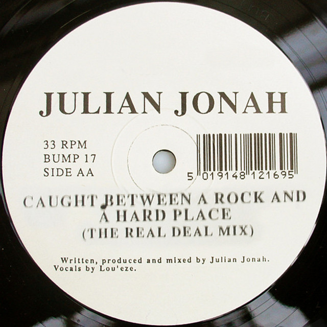Caught Between A Rock And A Hard Place cover art
