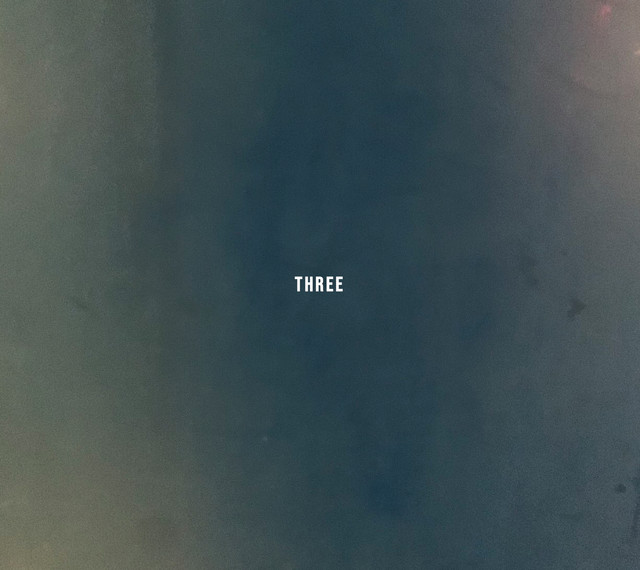 THREE cover art