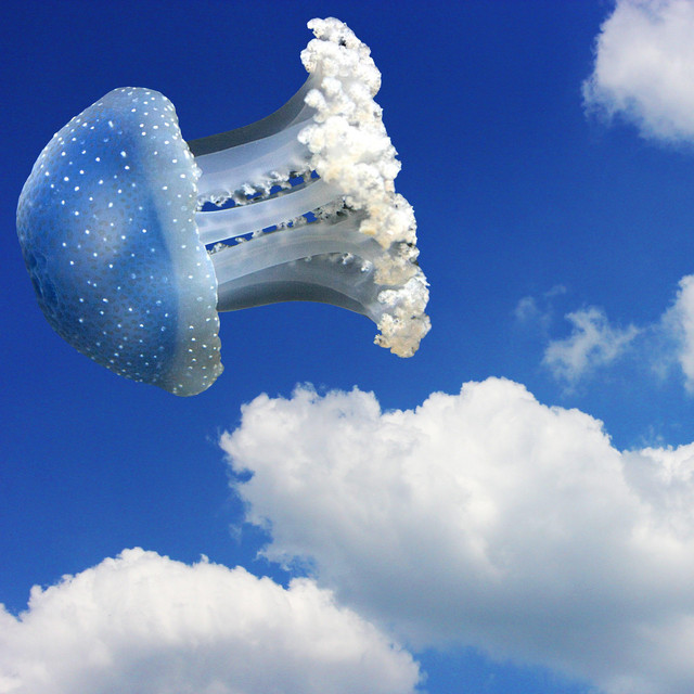 Cover art for HappyPizzaBread — A fluffy jellyfish is flying in the sky