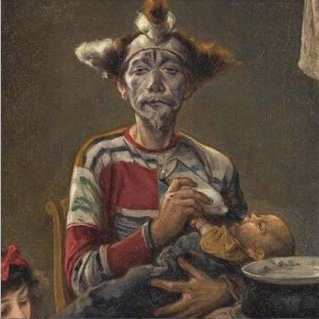 The funny clown feeds his baby album image