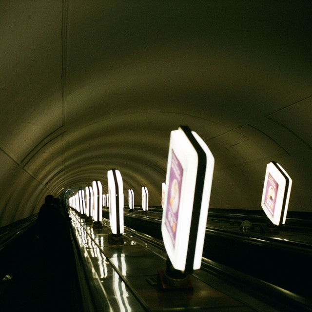 Cover art: Down the Escalator — Venture Silk