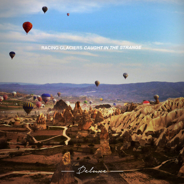 Caught in the Strange (Deluxe Edition) cover art