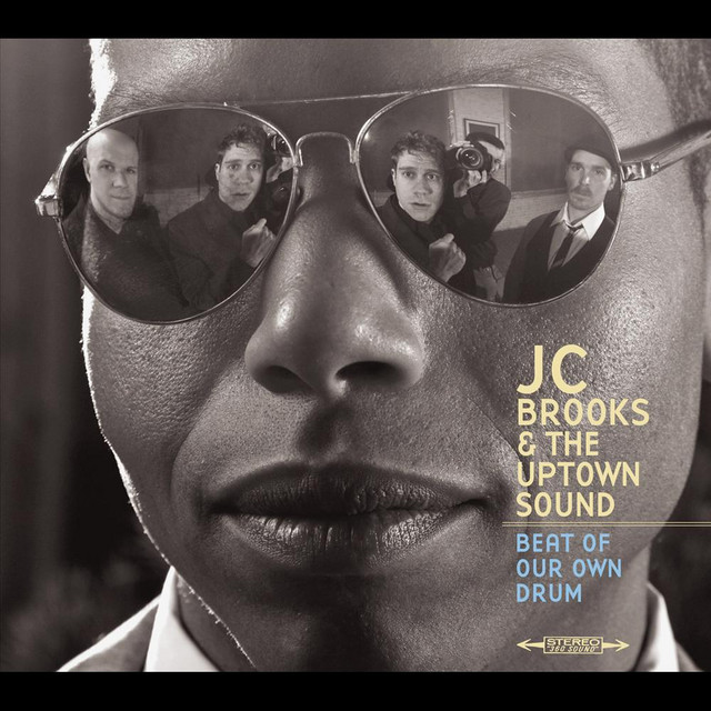 Omslag för Beat Of Our Own Drum av JC Brooks & The Uptown Sound