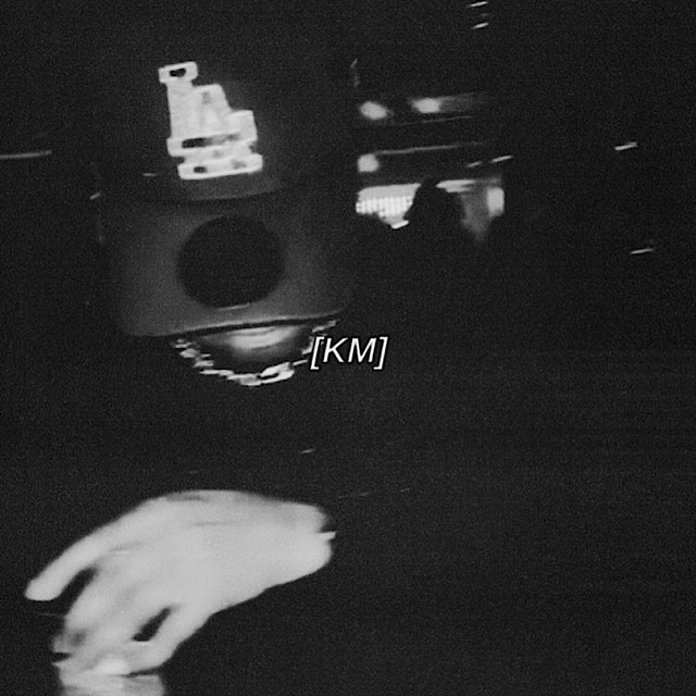 KM. cover art