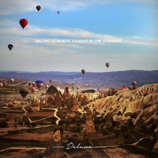 Caught In The Strange (Deluxe) cover art