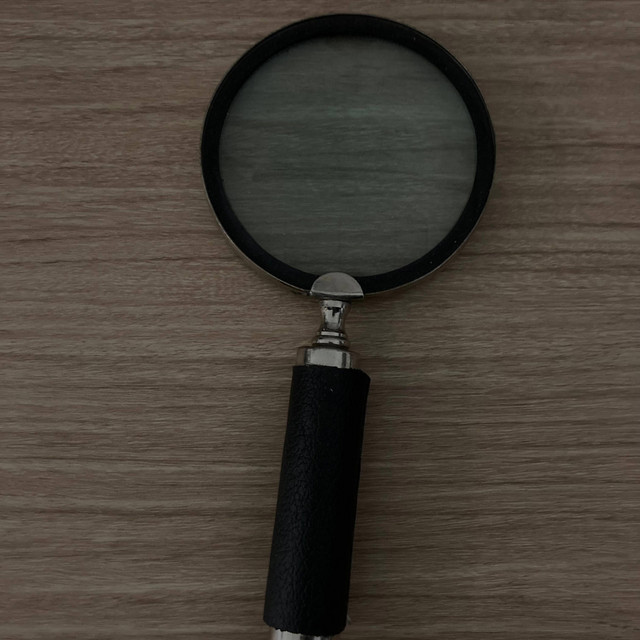 Magnifying glass cover art