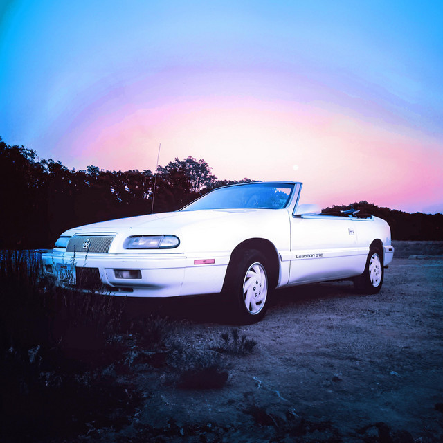 White Chrysler LeBaron cover art